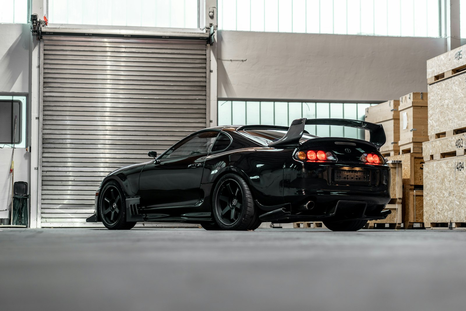 Black sports car with corrected, mirror-finish paint